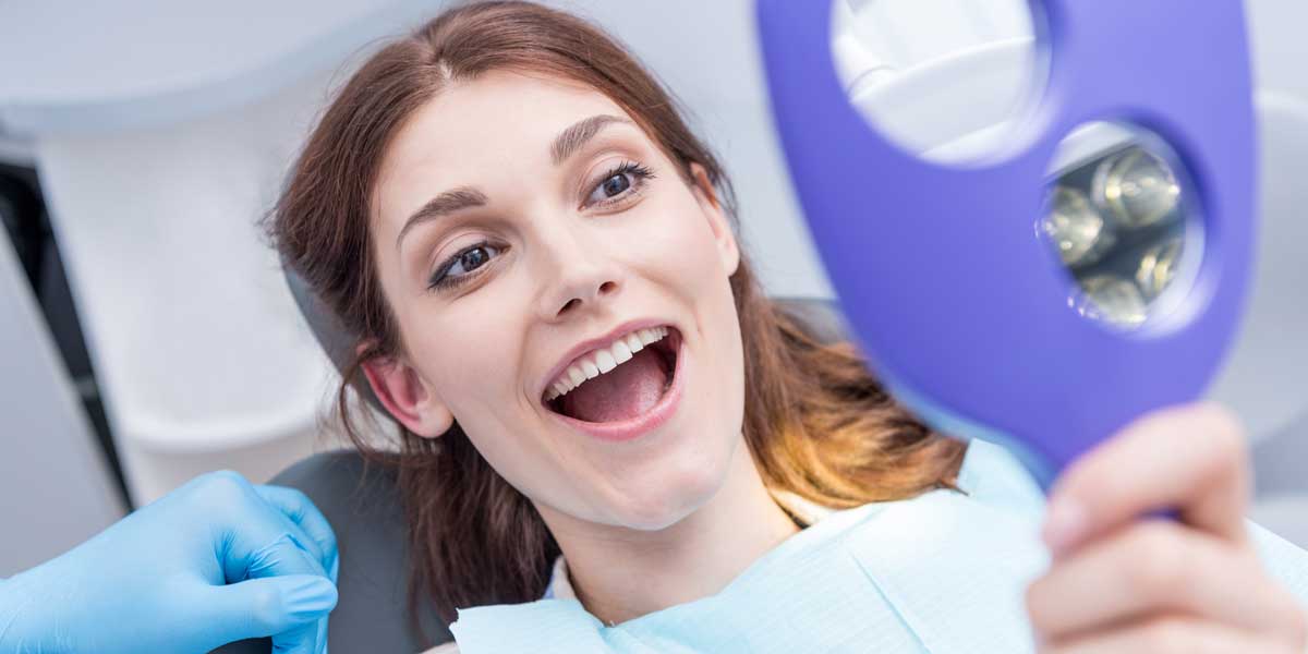 Happy Patient is Looking at Her Face